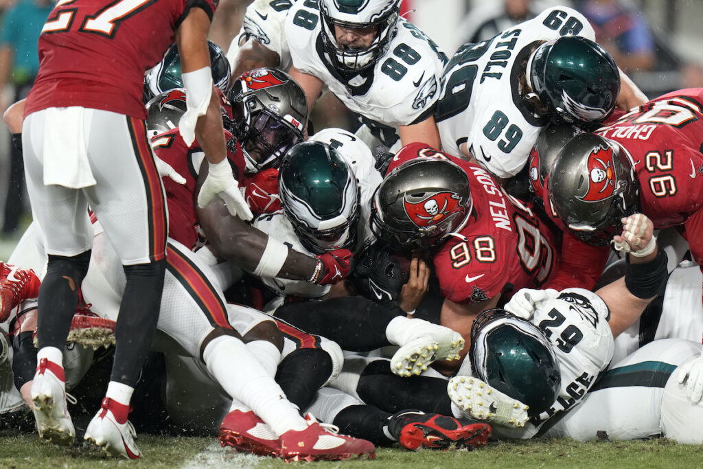 Philadelphia Eagles' Jalen Hurts, center, scores a touchdown during the second half of an NFL football game against the Tampa Bay Buccaneers, Monday, Sept. 25, 2023, in Tampa, Fla.