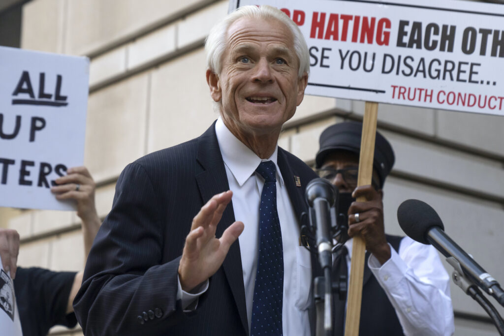 Peter Navarro speaking into a microphone