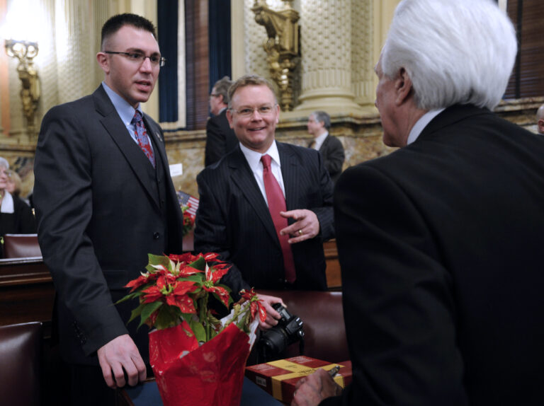 Ryan Bizzarro speaking with other House members