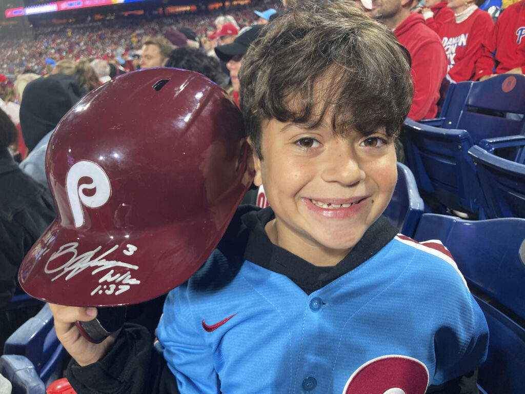 Phillies Harper Ejected Baseball Hayden Dorfman posing with the autographed helmet