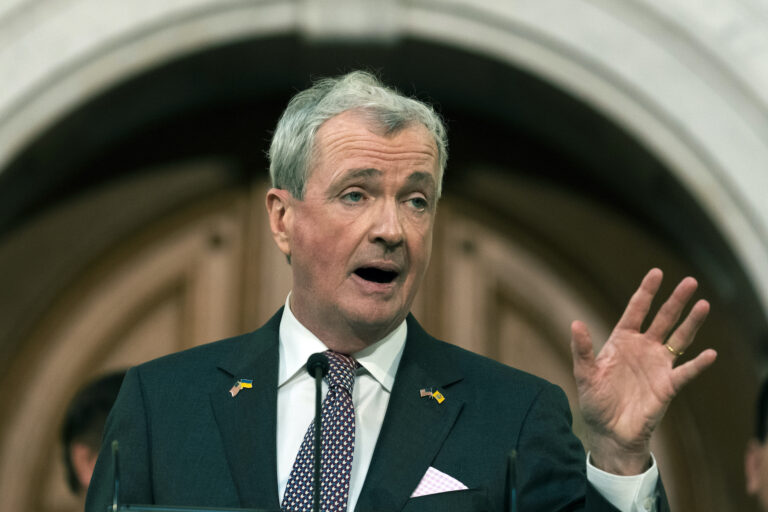 Phil Murphy speaking at a podium