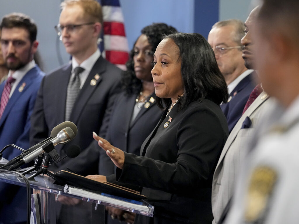 Fani Willis speaking at a podium