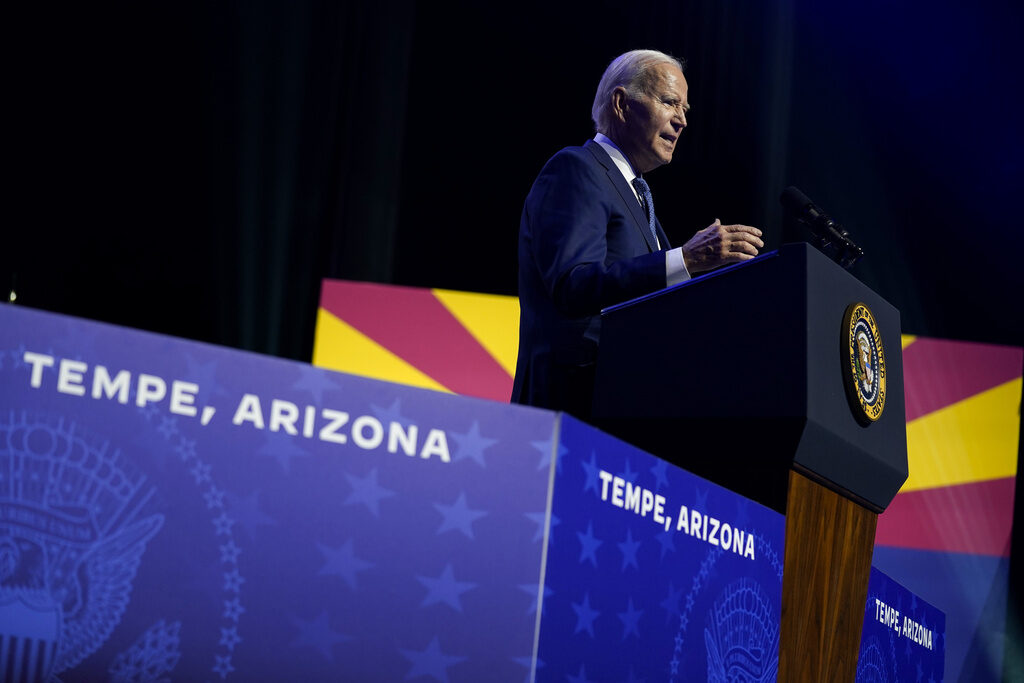 Biden President Joe Biden speaks at a podium