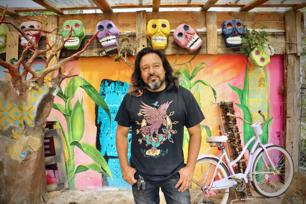 cesarviveros-artist-iglesiasgarden-05 Cesar Viveros stands on a performance stage he helped dreate at the Cesar Andreu Iglesias Garden in Kensington.