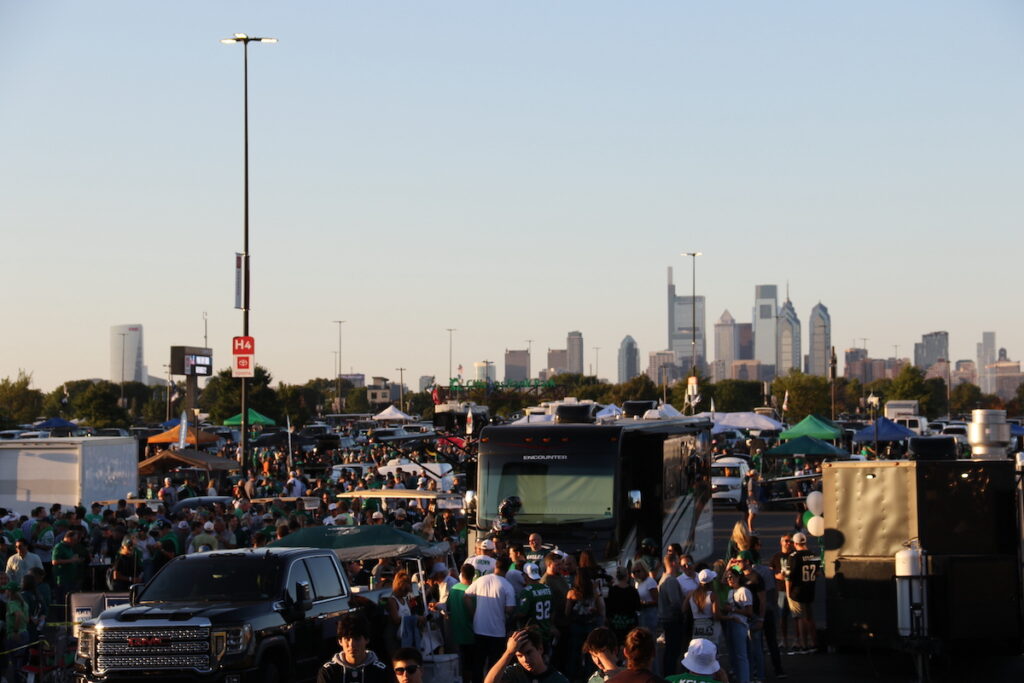 eagles-home-opener-2023-21 Eagles fans in the foreground, the Philly skyline visible in the background.