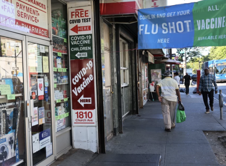 Pharmacy with signs advertising COVID tests and vaccines