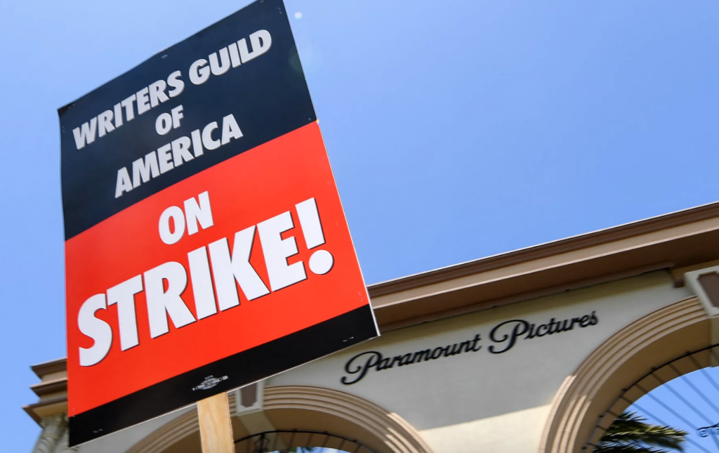 getty-wga-on-strike A closeup of a sign says ''Writers Guild of America on strike''