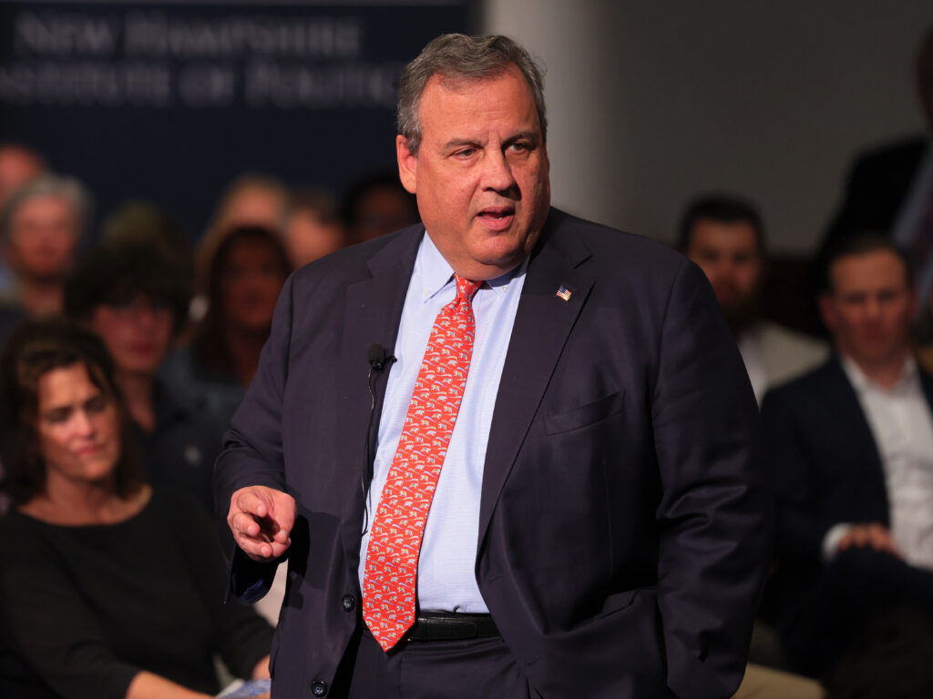 Former New Jersey Gov. Chris Christie speaks at a town hall-style event at the New Hampshire Institute of Politics at Saint Anselm College on June 6, Manchester, N.H. Chris Christie on stage