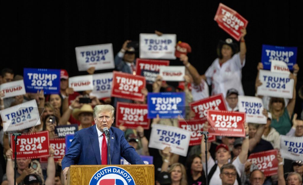 Former President Donald Trump speaks at a campaign rally in Rapid City, S.D., on Sept. 8. Trump speaking at a rally