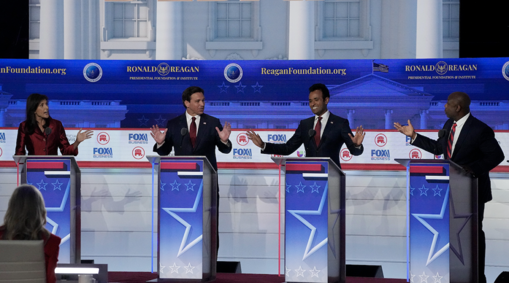 From left to right, former U.N. Ambassador Nikki Haley, Florida Gov. Ron DeSantis, businessman Vivek Ramaswamy and Sen. Tim Scott, R-S.C., argue a point during a Republican presidential primary debate at the Ronald Reagan Presidential Library in Simi Valley, Calif., on Wednesday.