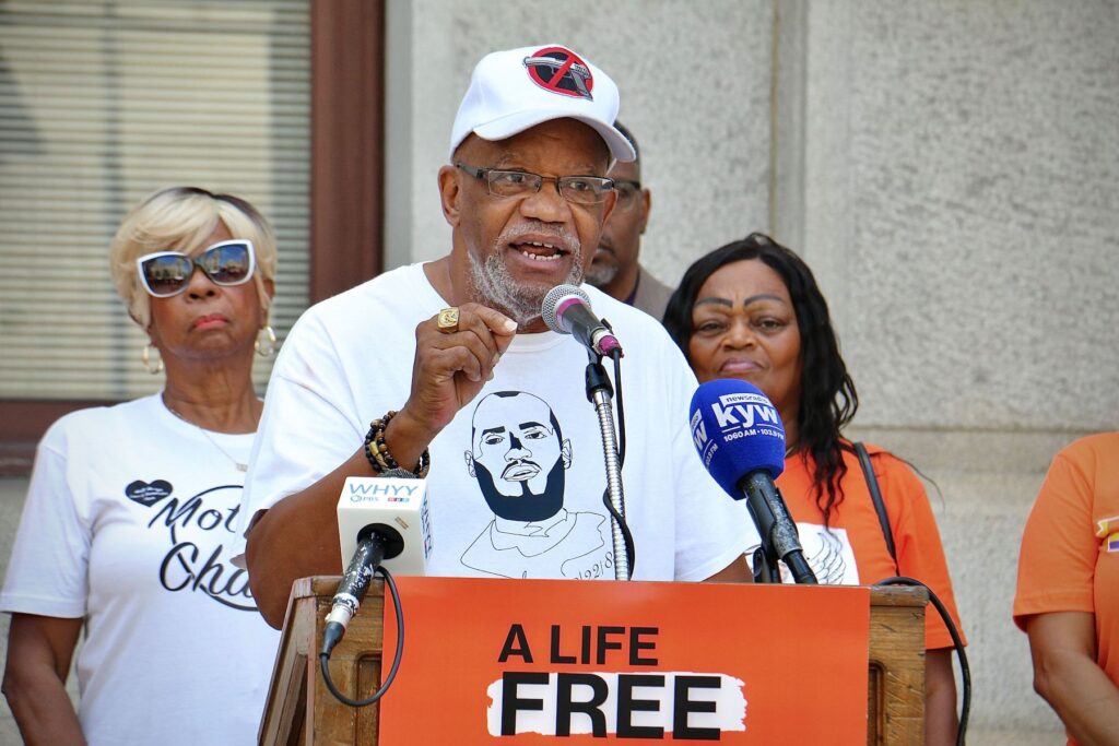 gun-violence-rally-supreme-court-city-hall-e-lee-2023-09-12-1 Stanley Crawford speaking at a podium