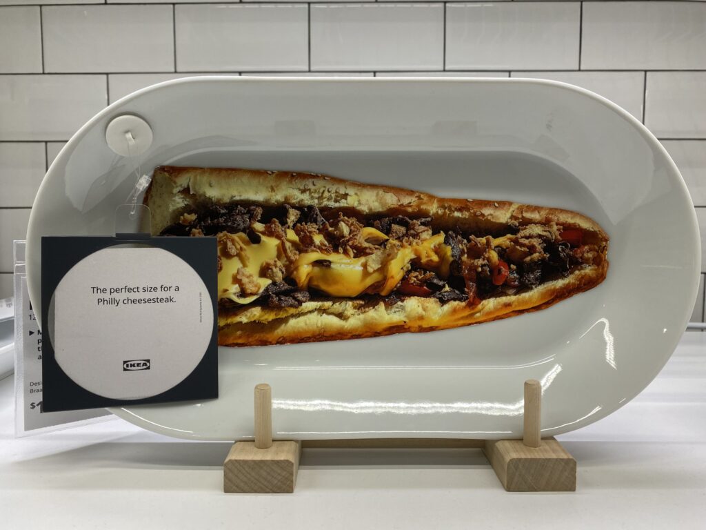 ikea-01-scaled A plate at Ikea with a cut-out image of a cheesesteak
