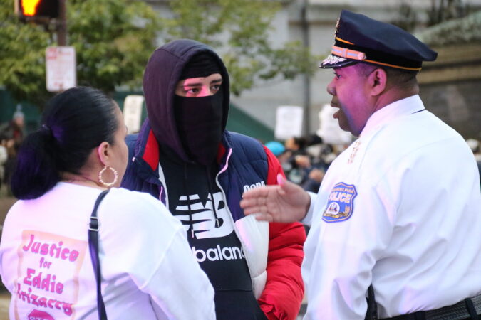 Philadelphia Police Interim Commissioner John Stanford Jr. (right) smoke with members of Eddie Irizarry's family as the protest wrapped up at City Hall