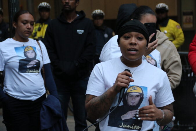 Aracelis Brown speaks into a microphone