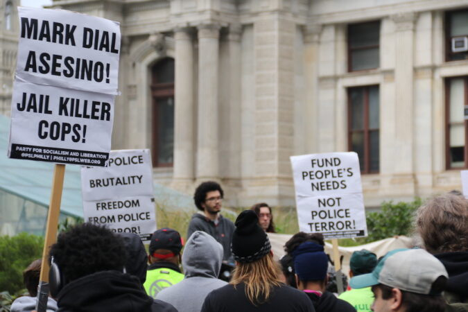 Signs held by protesters read 