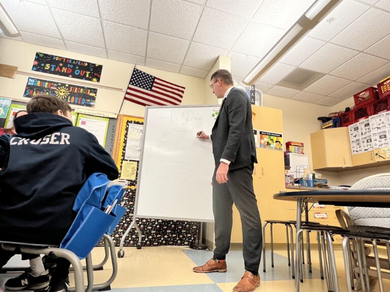 Matt Meyer teaching a class in a school room
