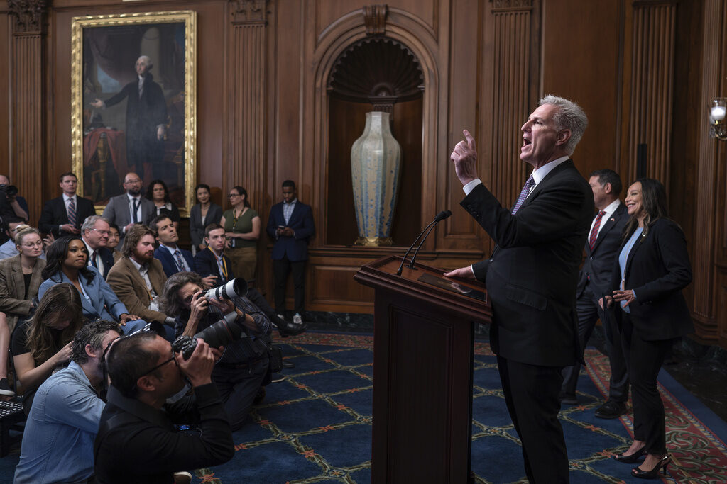 Kevin McCarthy, Mark Green, Monica de la Cruz Speaker of the House Kevin McCarthy speaks at a podium.
