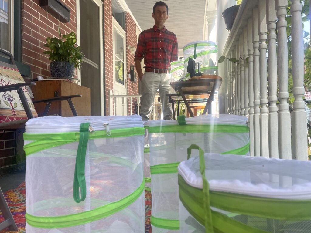 midnight-monarchs-c-barrish-2023-09-05-5 Jason Hoover on his front porch with various mesh cages
