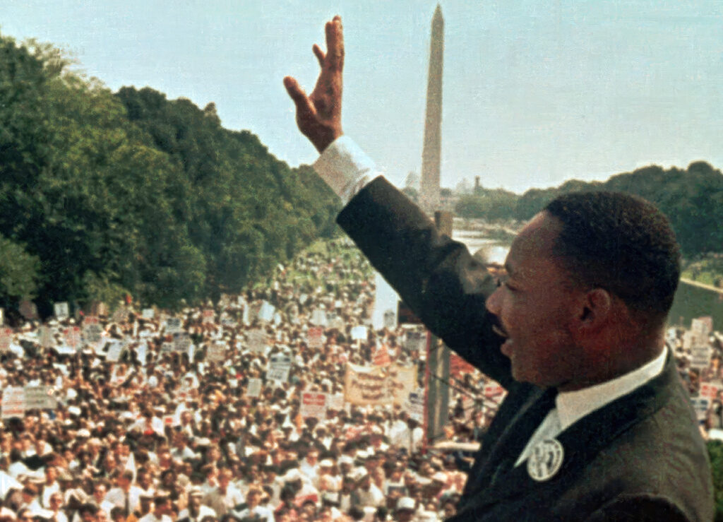 Voting Rights Act Voices Martin Luther King, Jr. waves to the crowd at the March on Washington in 1963