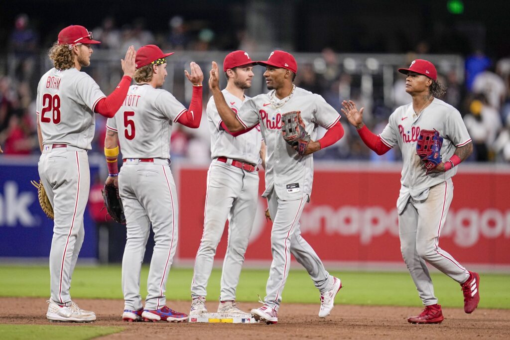 Members of the Philadelphia Phillies celebrate after the Phillies defeated the San Diego Padres 9-7 in a baseball game Monday, Sept. 4