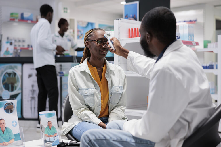 A doctor takes a patient's temperature