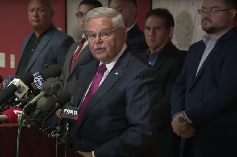 Robert Menendez speaking at a podium
