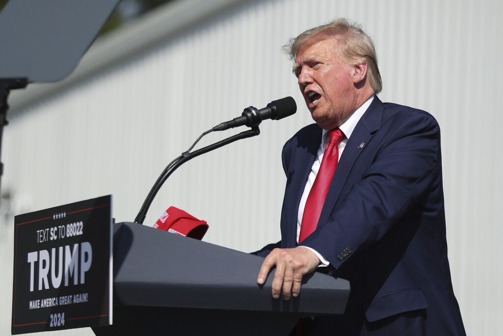 Donald Trump Trump speaks at a podium.