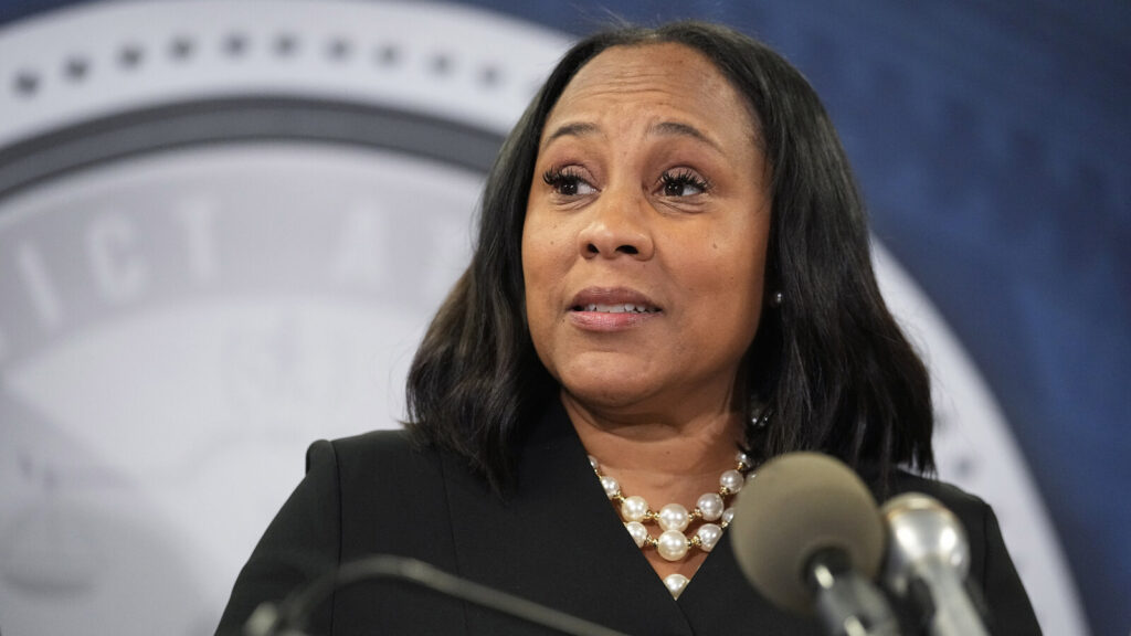 Georgia Election Investigation Fulton County District Attorney Fani Willis speaks into a microphone