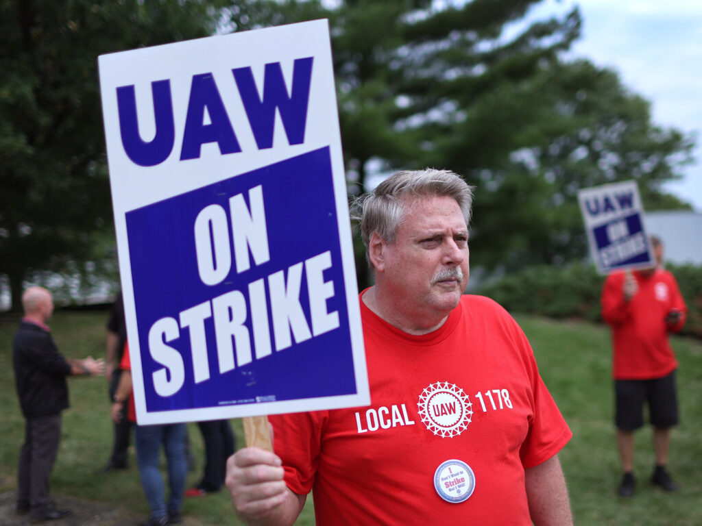 UAW Expands Ongoing Strike Against Big Three Automakers UAW workers picket outside of the Stellantis Mopar parts facility in Naperville, Ill., on Sept. 22, 2023. The UAW strike against Big Three automakers may not have much of an impact on car shoppers, though that could change. (Scott Olson/Getty Images)