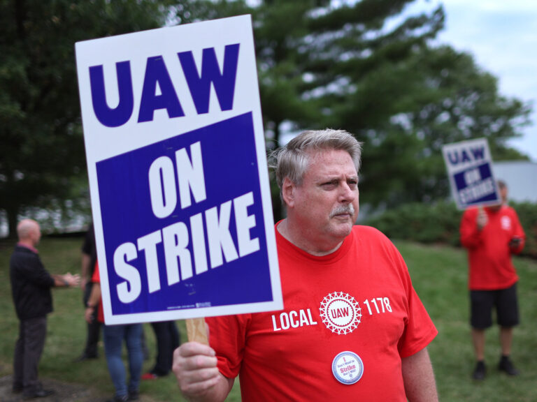UAW workers picket outside of the Stellantis Mopar parts facility in Naperville, Ill., on Sept. 22, 2023. The UAW strike against Big Three automakers may not have much of an impact on car shoppers, though that could change. (Scott Olson/Getty Images)