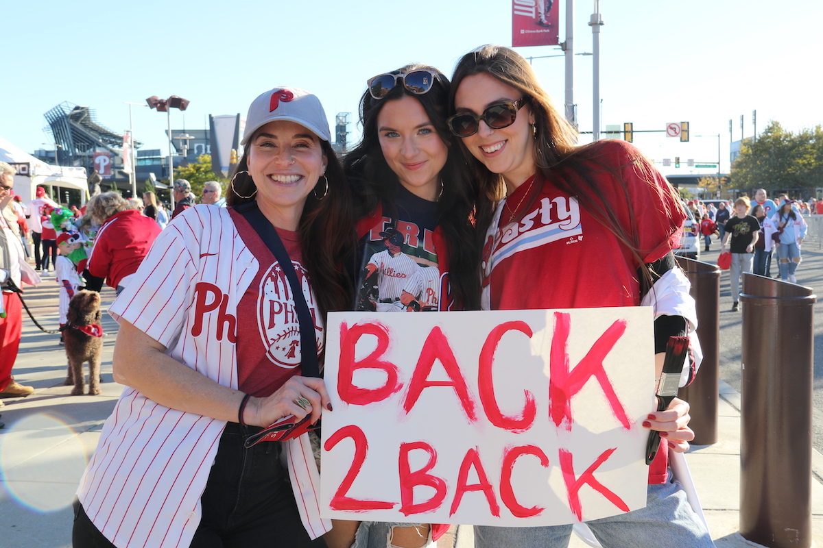 Michele Harris brought her niece Emma, along with her friend Maddie Baxter to watch the Phils inch closer to a potential World Series berth. (Cory Sharber/WHYY)