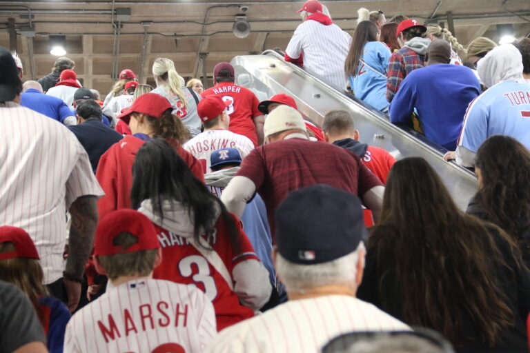 Fans emptied out of the Broad Street Line at NRG Station to witness their favorite team play for a shot at the World Series. (Cory Sharber/WHYY)