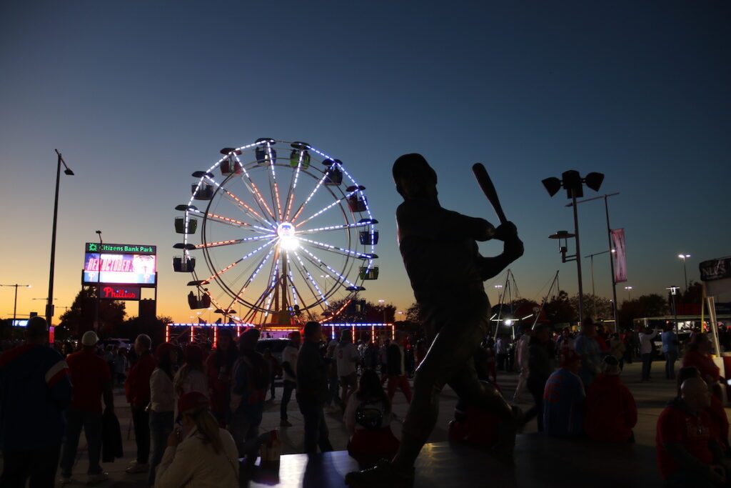 019A2099 A statue of a baseball player is seen against the night sky