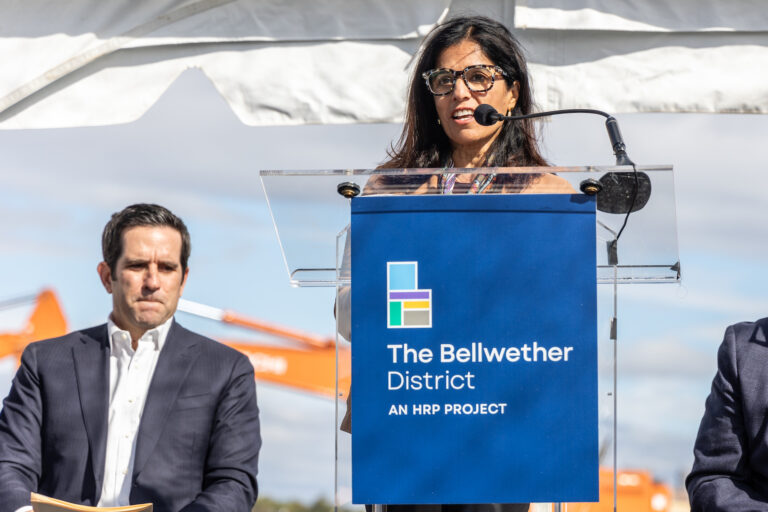 Seema Nanda speaking at a podium