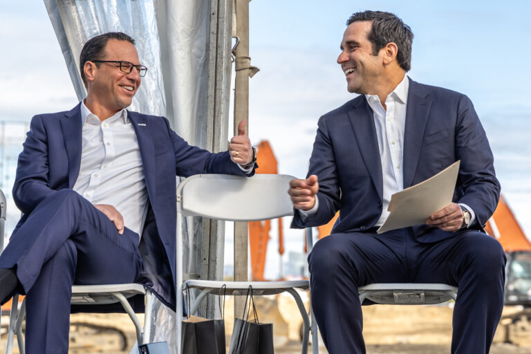Josh Shapiro and Robert Perez sitting and laughing together