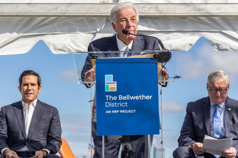 William Sasso speaking at a podium