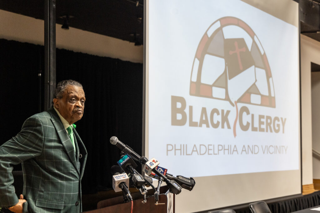 10 17 2023 k paynter black clergy arena endorsement Rev. Robert Collier Sr. speaking at a podium