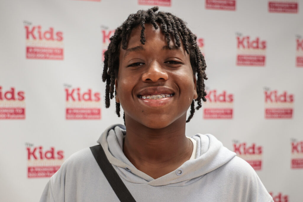 10 23 2023 k paynter kids campaign panel at YMCA-8 Corey Theodore smiles for a portrait