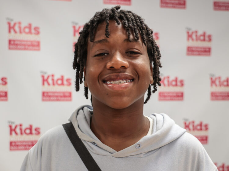 Corey Theodore smiles for a portrait