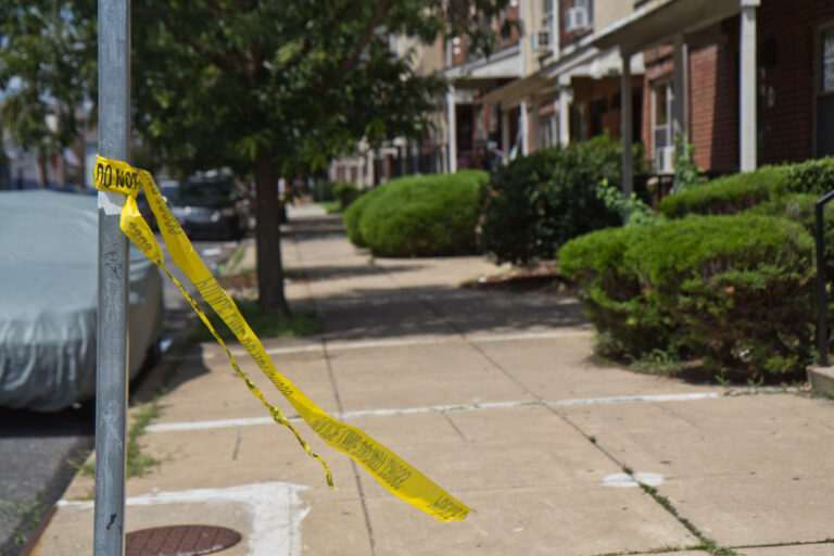 broken police tape at a crime scene.