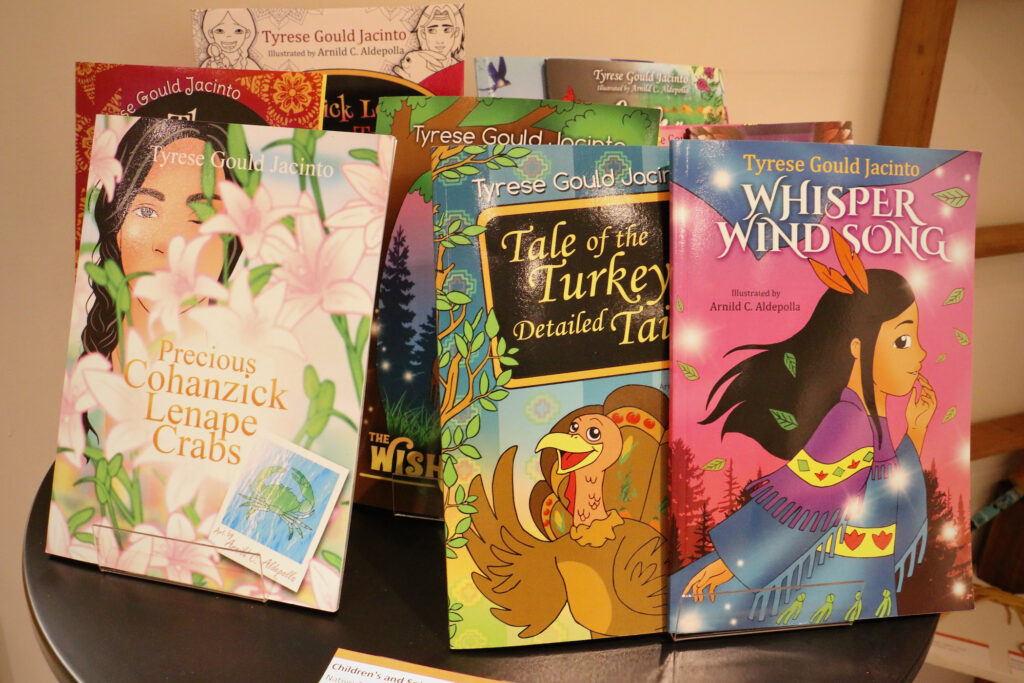 Several children's books written by Tyrese Gould Jacinto on display