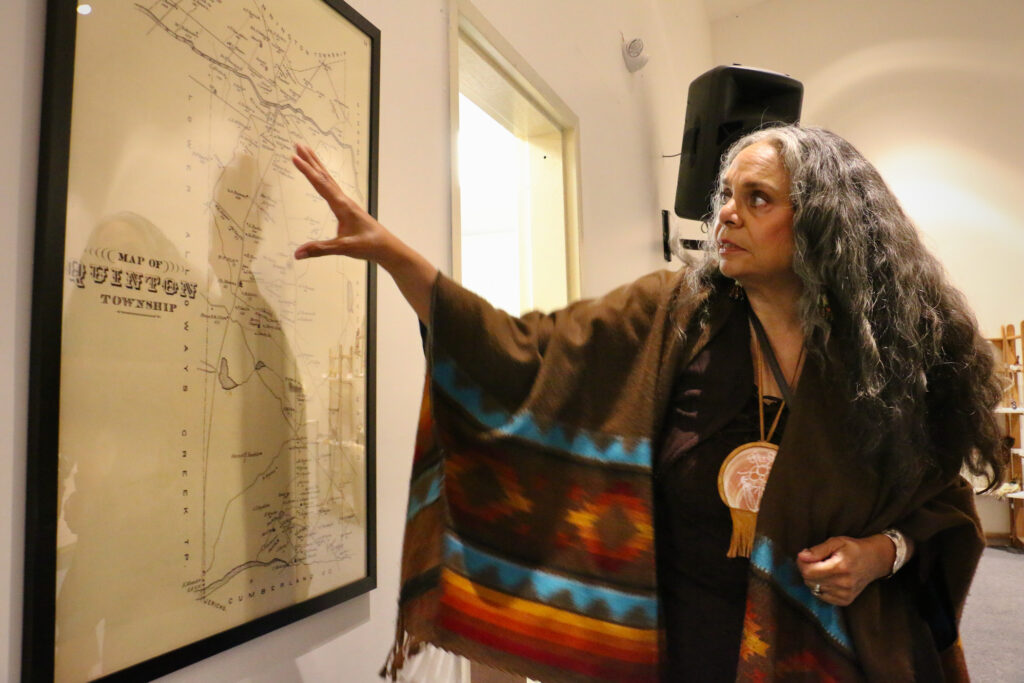 Tyrese Gould Jacinto points towards a map