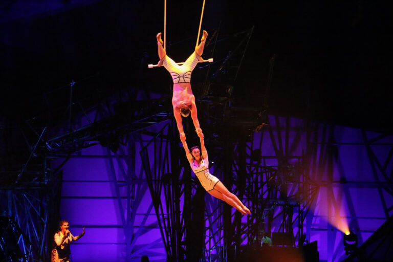 Trapeze artists perform in Cirque du Soleil's ''Bazzar'' at the Greater Philadelphia Expo Center in Oaks, Pa. (Emma Lee/WHYY)