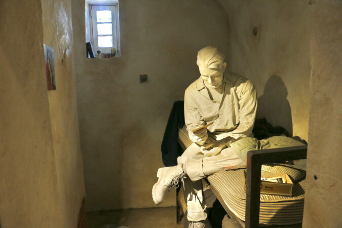 A statue in a cell