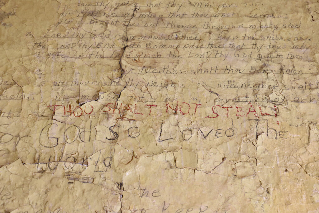 Graffiti on the wall of a former cell