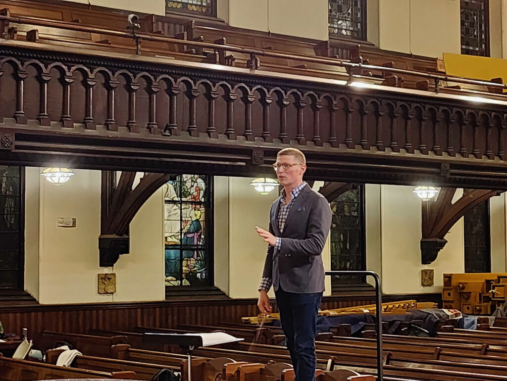 Dominick Diorio stands in the Church of Holy Trinity