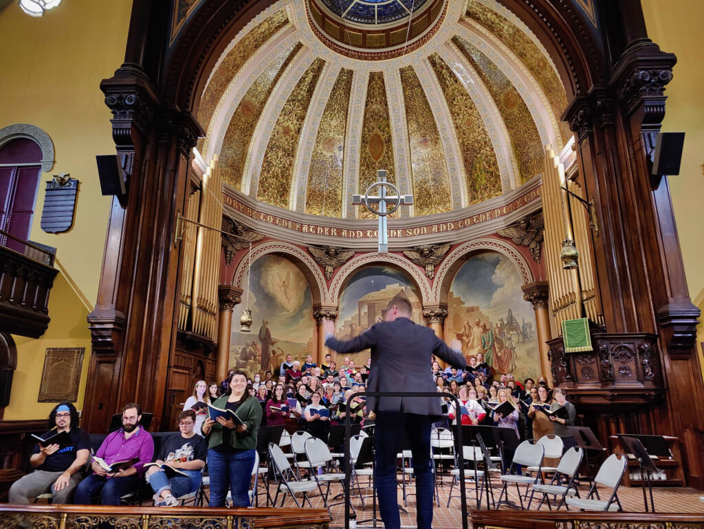 Dominick Diorio conducts the choir