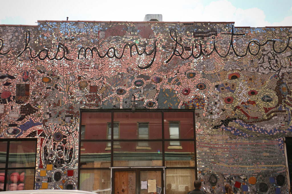"The Bride has many Suitors..." begins an inscription across the front of a large mosaic