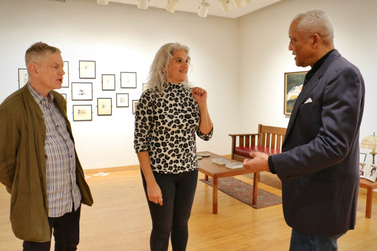 Fleisher Art Memorial Director Monica Zimmerman (center) talks with Mark Rollins (right) and Ron Rumford at the new exhibit