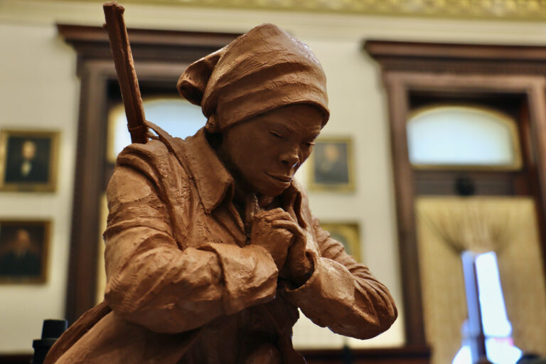 The hands of Alvin Pettit's Harriet Tubman statue are folded in prayer, or perhaps clenched. (Emma Lee/WHYY)